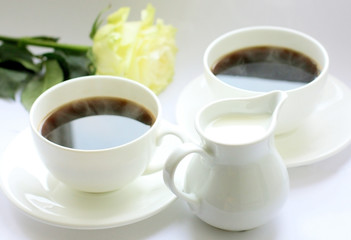 Two cups of invigorating coffee or cream tea in the morning.