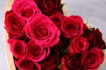 Red roses with hearts on background for valentines day concept