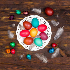 Happy Easter. Painted eggs of different colors on a wooden table