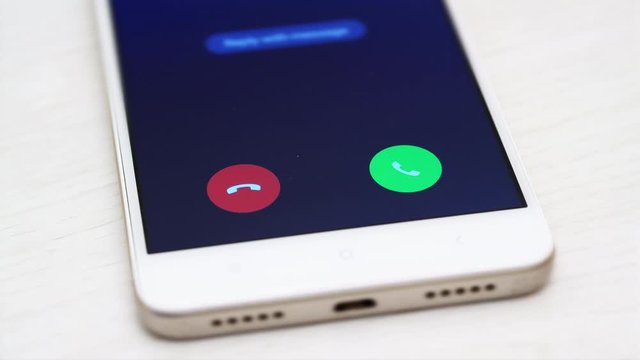 4K - Man declines a call on a smartphone