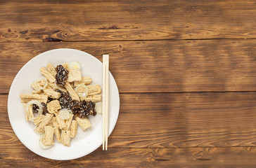Spicy Chinese or Korean Yuba tofu bamboo and Oyster mushrooms on wooden background.