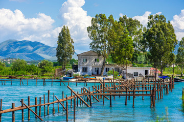 An oyster farm on Lake Butrint near Ksamil, Albania on a beautiful sunny day - obrazy, fototapety, plakaty