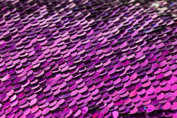 Fototapeta premium Purple sequins pattern macro view