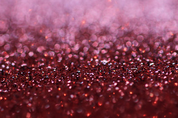 Red abstract texture with out of focus highlights and copy space