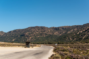 The alone small booth. Road in Volcanic mountains in Nisyros Greece. Beautiful landscape.