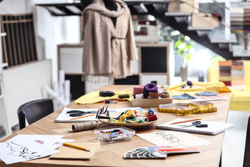 Fashion designer's workplace in studio. Creating new clothes