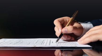 Lawyer, notary, attorney signs document