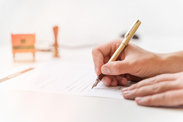 Lawyer working in office. Notary signs document