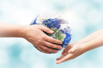 Earth globe in hands. World environment day. Elements of this image furnished by NASA.
