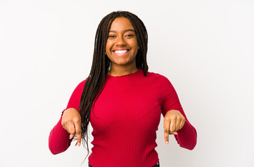 Young african american woman isolated points down with fingers, positive feeling.