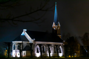 Lutheran church at night in Pinki parish, Latvia