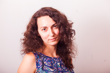 Portrait of attractive middle-aged woman with curly hair