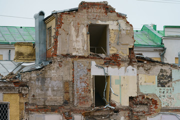 Photography of destroyed house in the Moscow. Demolition of dilapidated housing. Renovation...