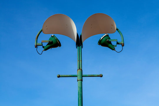 A street light against a blue sky