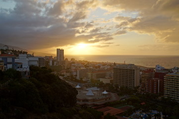 Naklejka na ściany i meble picturesque sunset on the Spanish island of Tenerife in the city of Puerto de la Cruz