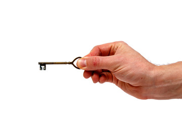 Male hand holding a vintage key isolated on white background. Minimalistic concept.