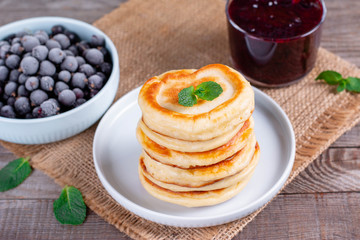Stack of pancakes topped with berry jam