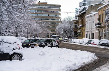 Snow on cars in the morning. Winter season and icy cars on the road in morning rush hour traffic of...