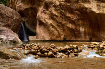 Natural swimming pool inside a cave with a small waterfall in Padules. Andalusia. Spain.