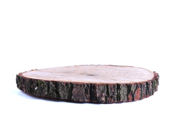 Detailed piece of circular flat cut wood showing annual rings, cracks, bark and texture.