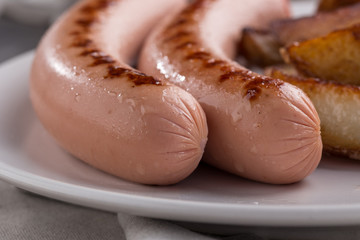 Close-up shot of fried sausages. Breakfast. Close up shot of grilled sausages