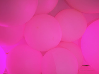 pink background made of neon balls.