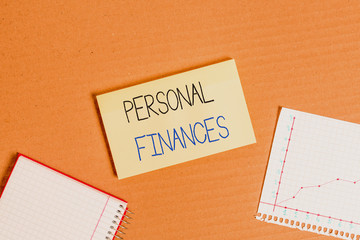 Writing note showing Personal Finances. Business concept for the activity of analysing own money and financial decisions Cardboard notebook office study supplies chart paper