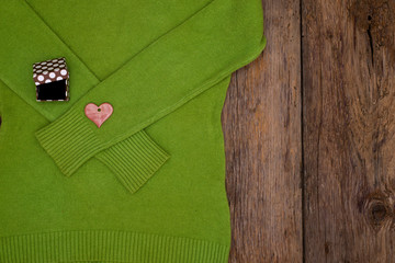 Valentine's day gift heart and box on a green pullover