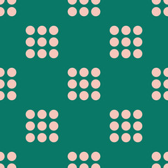 Seamless vector pattern with light pink blocks of circles arranged in a grid on an emerald green background. Modern geometric design great for fashion, packaging, stationery, paper goods, home decor.
