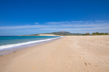 Fototapeta na wymiar landscape of seaside in beautiful sandy big and lonely Valdevaqueros Beach, in Tarifa, Cadiz, Andalusia, Spain