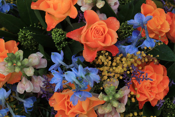 Orange and blue flower arrangement for a wedding