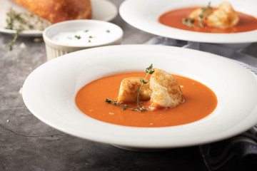 Orange Tomato Soup with Rustic Croutons in White Bowls