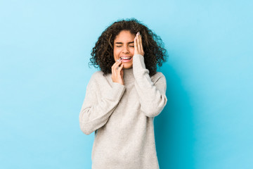 Young african american curly hair woman whining and crying disconsolately.