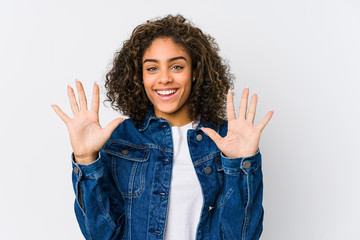 Young african american woman showing number ten with hands.