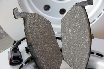 Car parts. Brake discs and brake pads with sensor. © Natallia