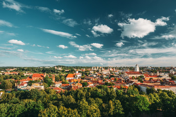 Fototapeta premium Vilnius, Lithuania. Old Town Historic Center Cityscape Under Dramatic Sky And Bright Sun In Sunny Summer Day. Travel Panorama. UNESCO. Famous And Popular Place