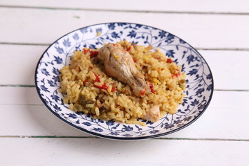 plate of rice with chicken and peppers