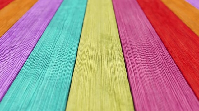 Old wood plank rainbow background with depth of field. Seamless loop 3d render