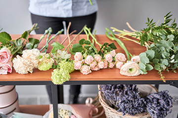 Education in the school of floristry. Master class on making bouquets. Summer bouquet. Learning flower arranging, making beautiful bouquets with your own hands. Flowers delivery