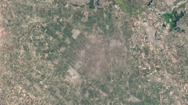 Aerial satellite animation of agricuture land from green to dried up brown, Jizzakh Uzbekistan. Images furnished by Nasa