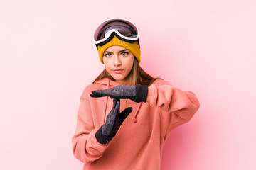 Young caucasian woman wearing a ski clothes isolated showing a timeout gesture.