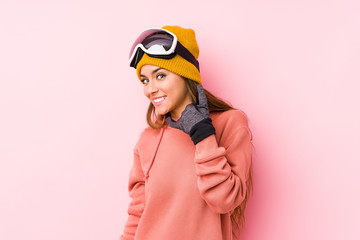 Young caucasian woman wearing a ski clothes isolated showing a mobile phone call gesture with fingers.