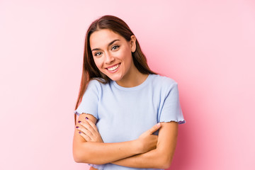 Obraz premium Young caucasian woman wearing a ski clothes isolated laughing and having fun.