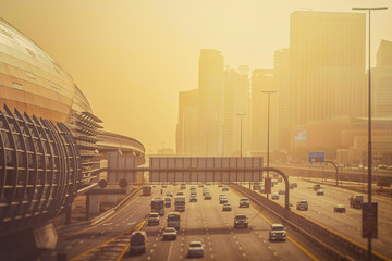 Damac Properties Metro Station with Sheikh Zayed road in hazy weather during afternoon