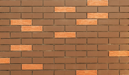 A piece of wall made of multicolored brick.