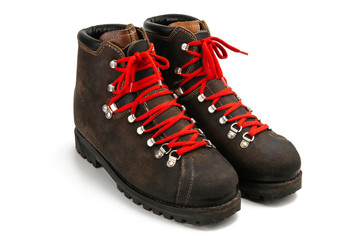 Isometric view of a pair of old stylish hipster classic brown leather boots with red laces on white...