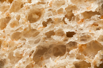 Macro of bread slice. Brown bakery food, loaf with grains.