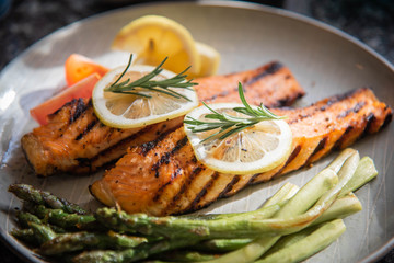 grilled salmon fillet on plate with asparagus