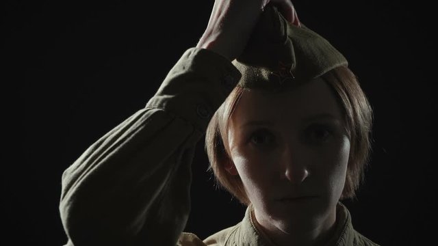 Video of woman in soviet red army uniform in shadow