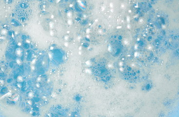 Foam bubble from soap or shampoo washing on top view. Foam background. White foam.